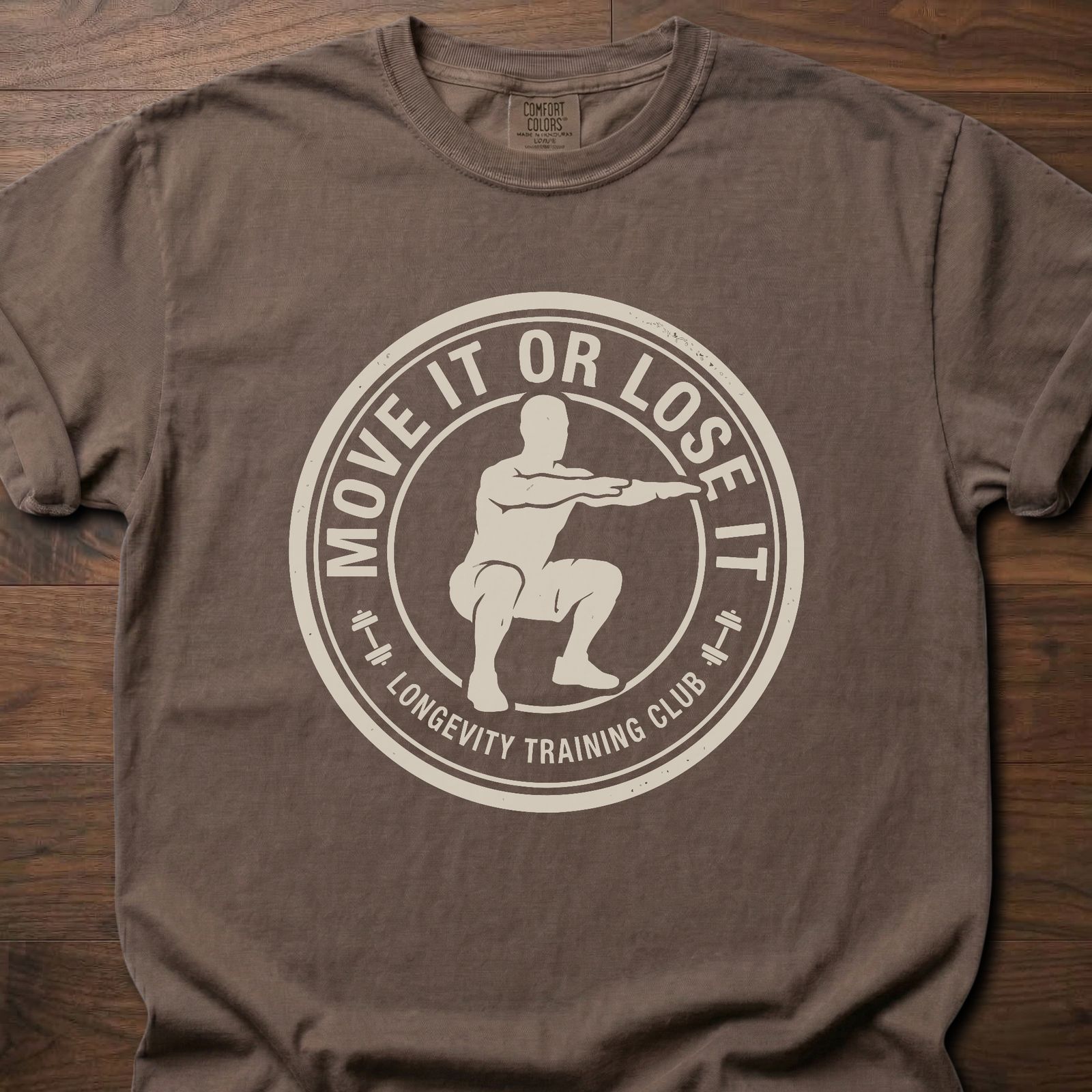 Move It Or Lose It fitness lifestyle apparel featuring figure doing squat inside circular badge design – Espresso