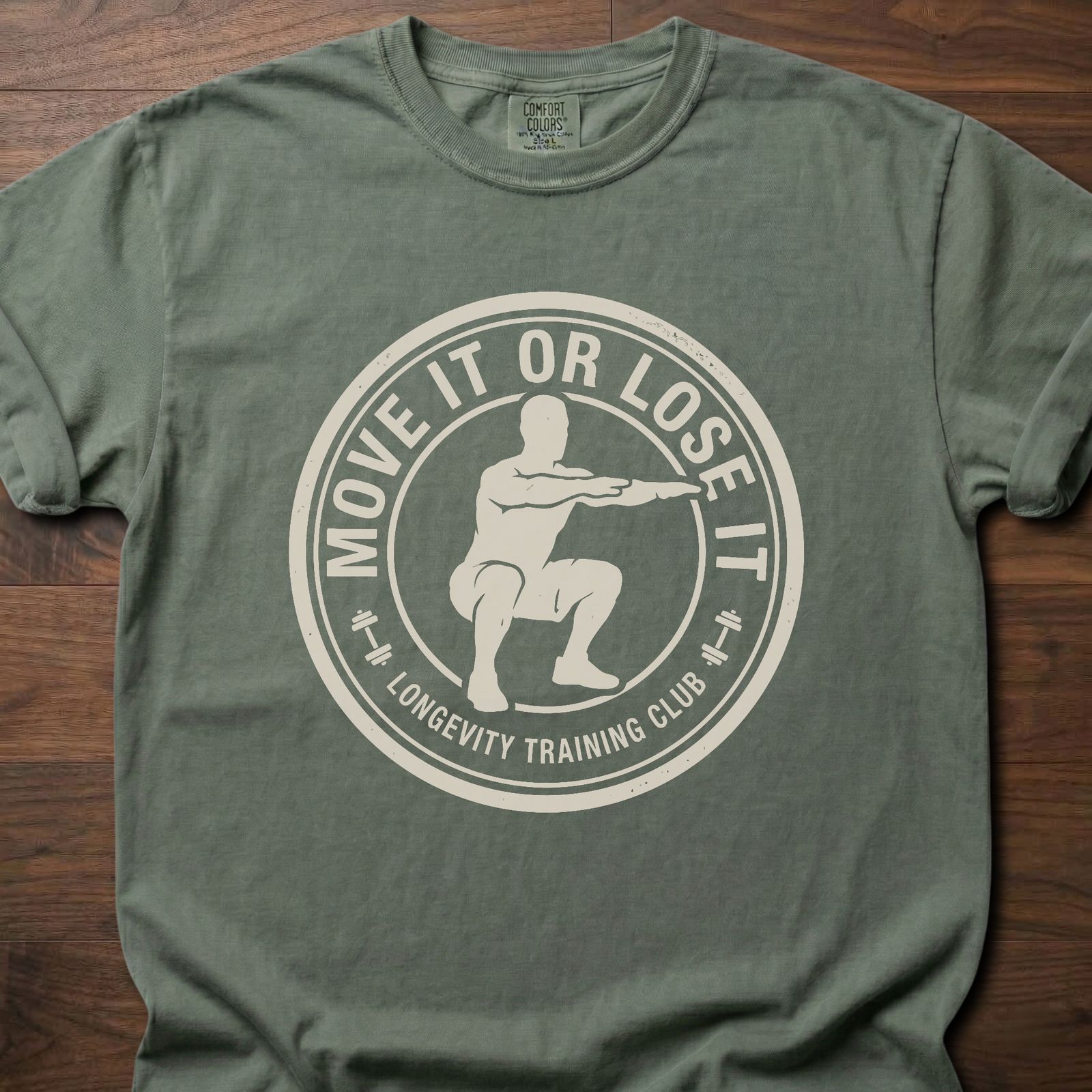 Move It Or Lose It fitness lifestyle apparel featuring figure doing squat inside circular badge design – Moss