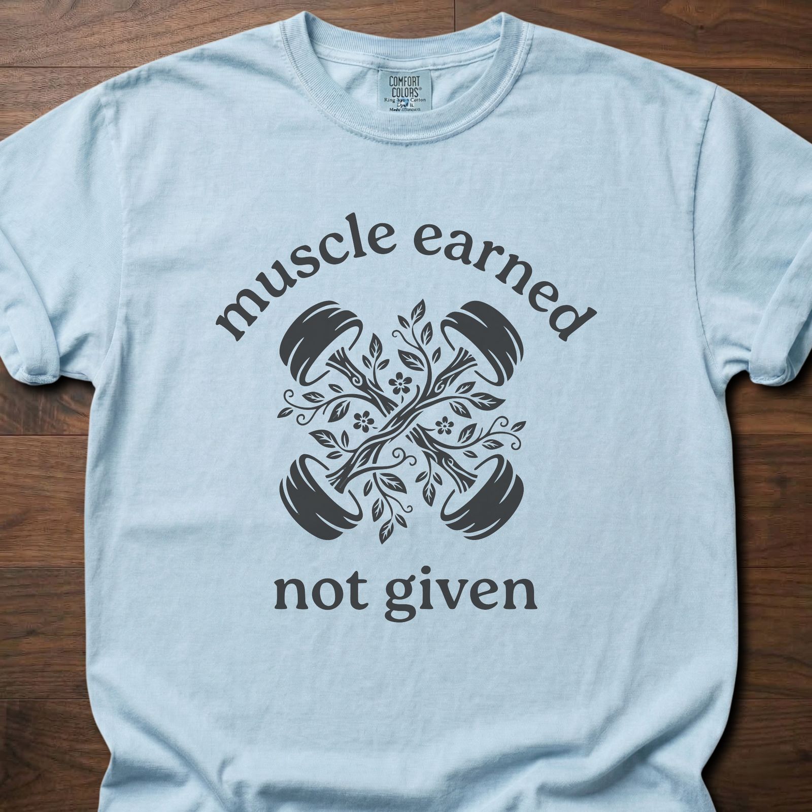 Muscle Earned fitness lifestyle apparel featuring crossed dumbbells with decorative floral design – Chambray