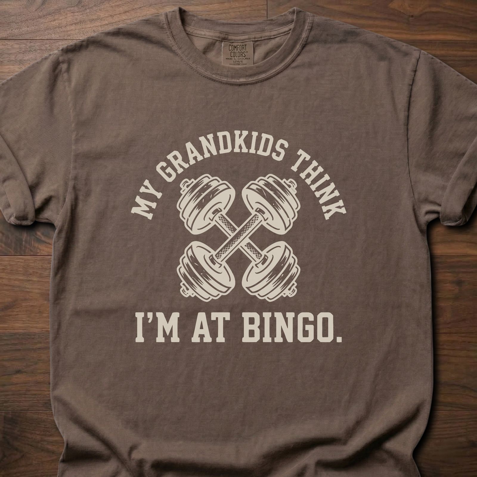 My Grandkids Think strength training t-shirt with crossed dumbbells and bingo humor – Espresso