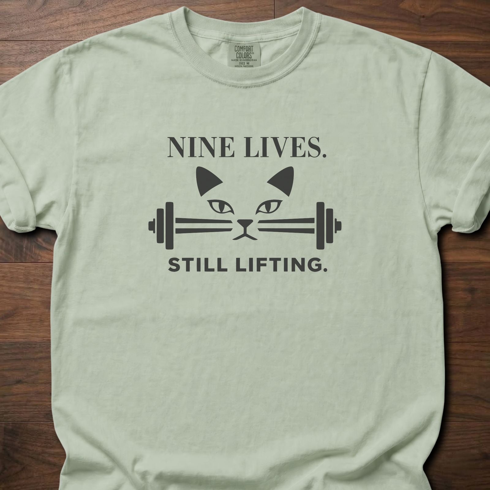 Nine Lives strength training lifestyle t-shirt with cat face and barbell graphic – Bay