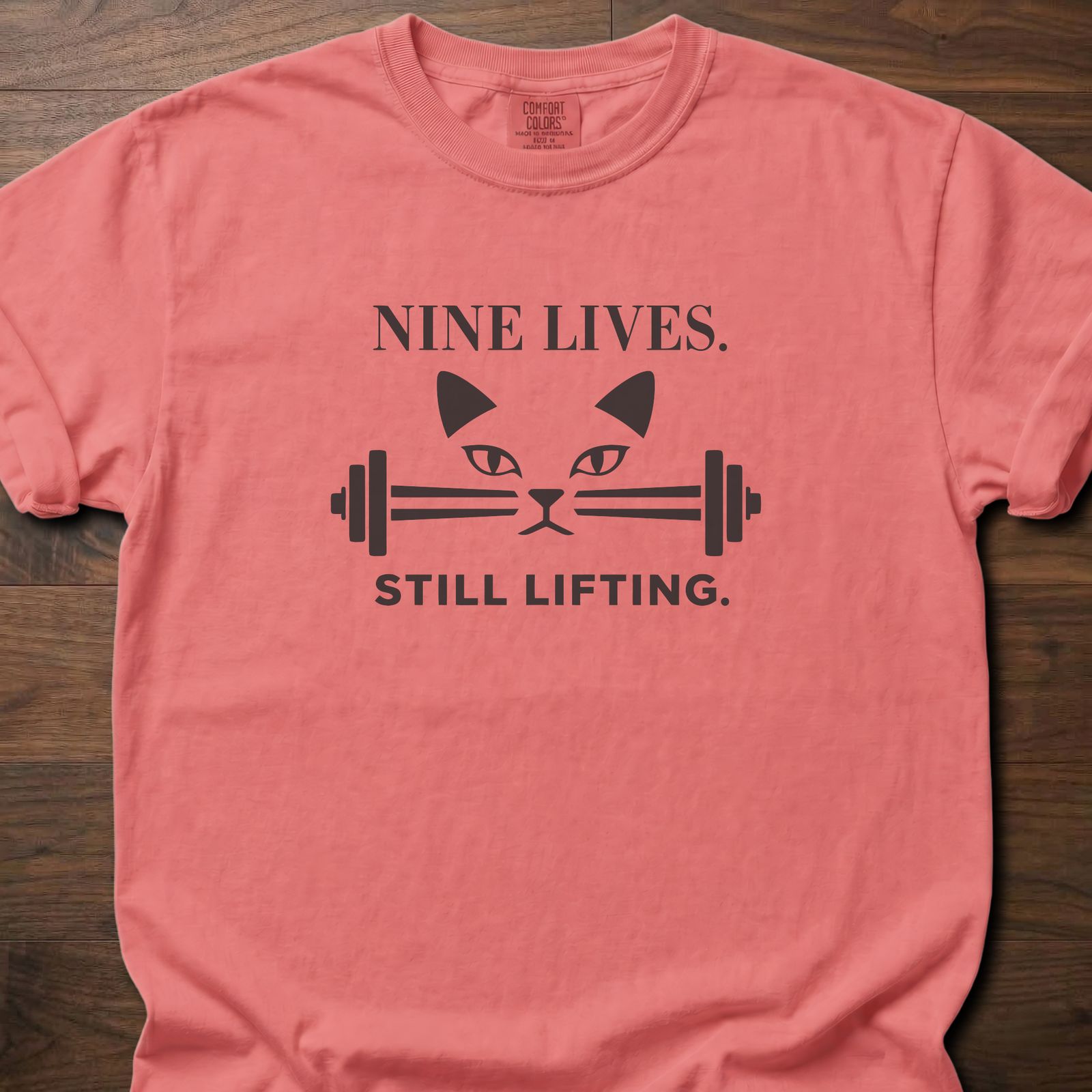 Nine Lives strength training lifestyle t-shirt with cat face and barbell graphic – Watermelon