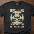 Not Dead Just Resting strength training t shirt with skull and dumbbells design – Black