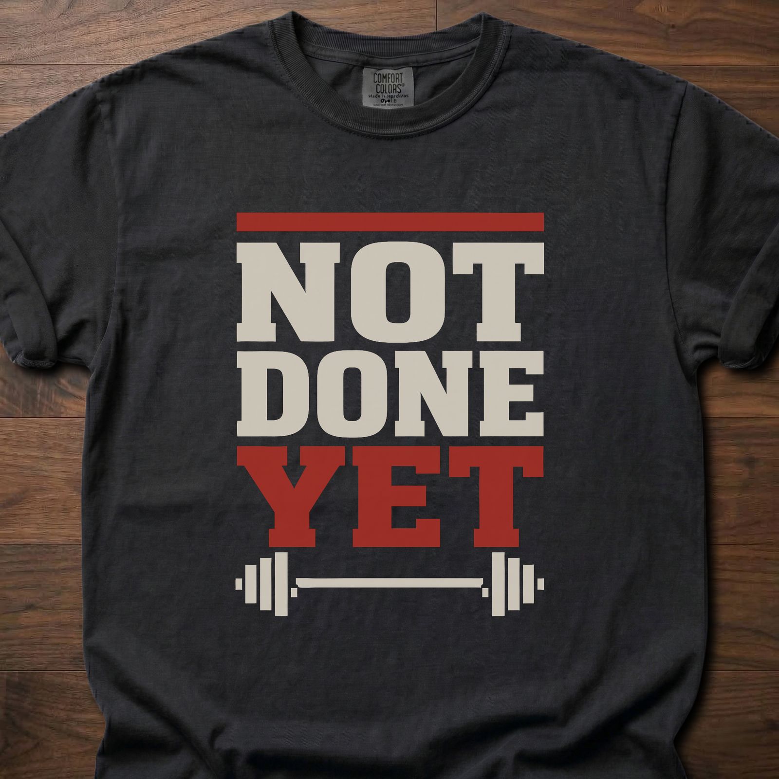 Not Done Yet longevity fitness apparel featuring bold text with barbell graphic – Black