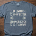 Old Enough T-Shirt featuring barbell graphic with humorous text about strength training lifestyle clothing – Blue Jean