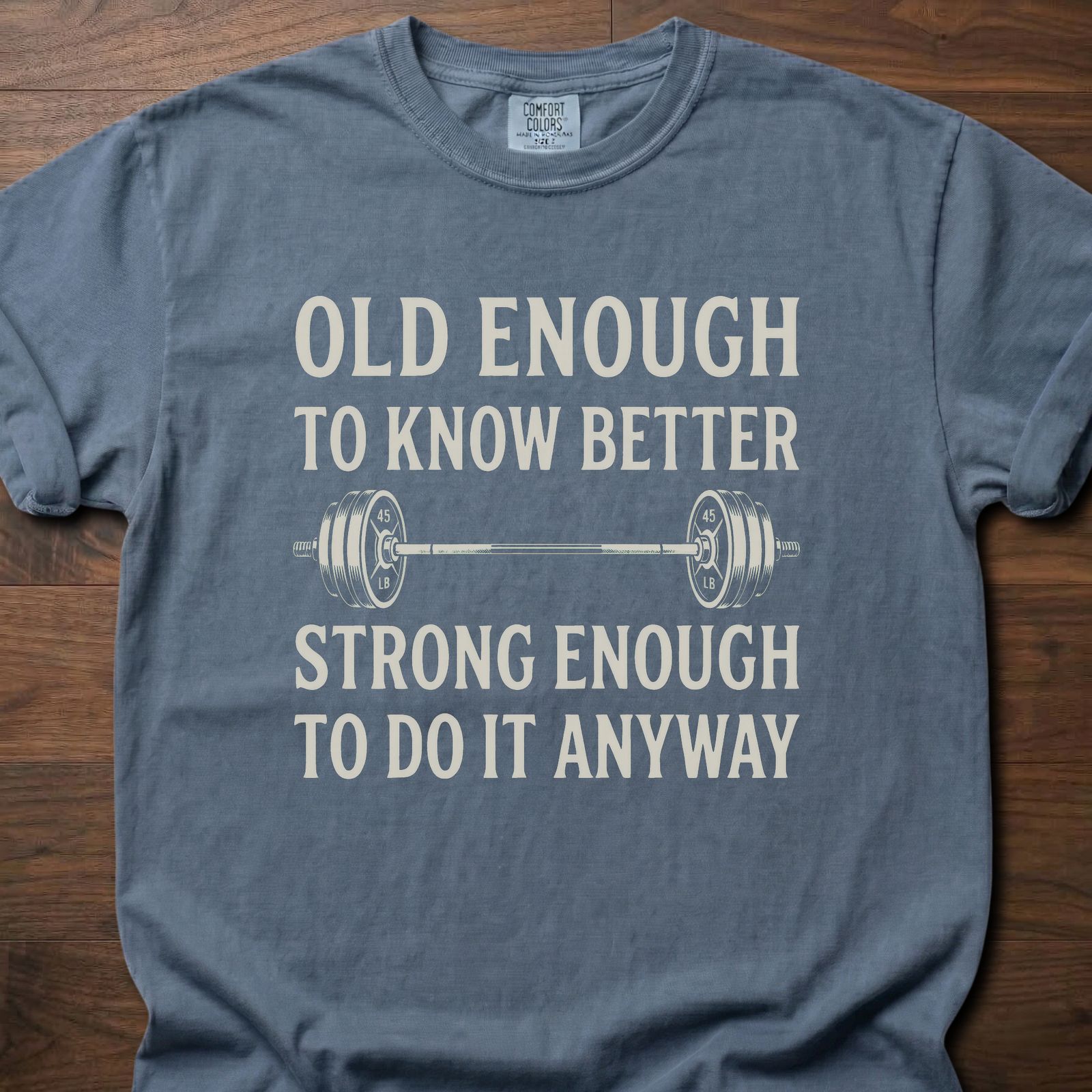 Old Enough T-Shirt featuring barbell graphic with humorous text about strength training lifestyle clothing – Blue Jean
