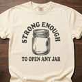 Open Any Jar strength training t-shirt featuring mason jar graphic and bold text design – Ivory