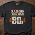 Raising The Bar strength training t-shirt with loaded barbell and retro 80s graphic – Black