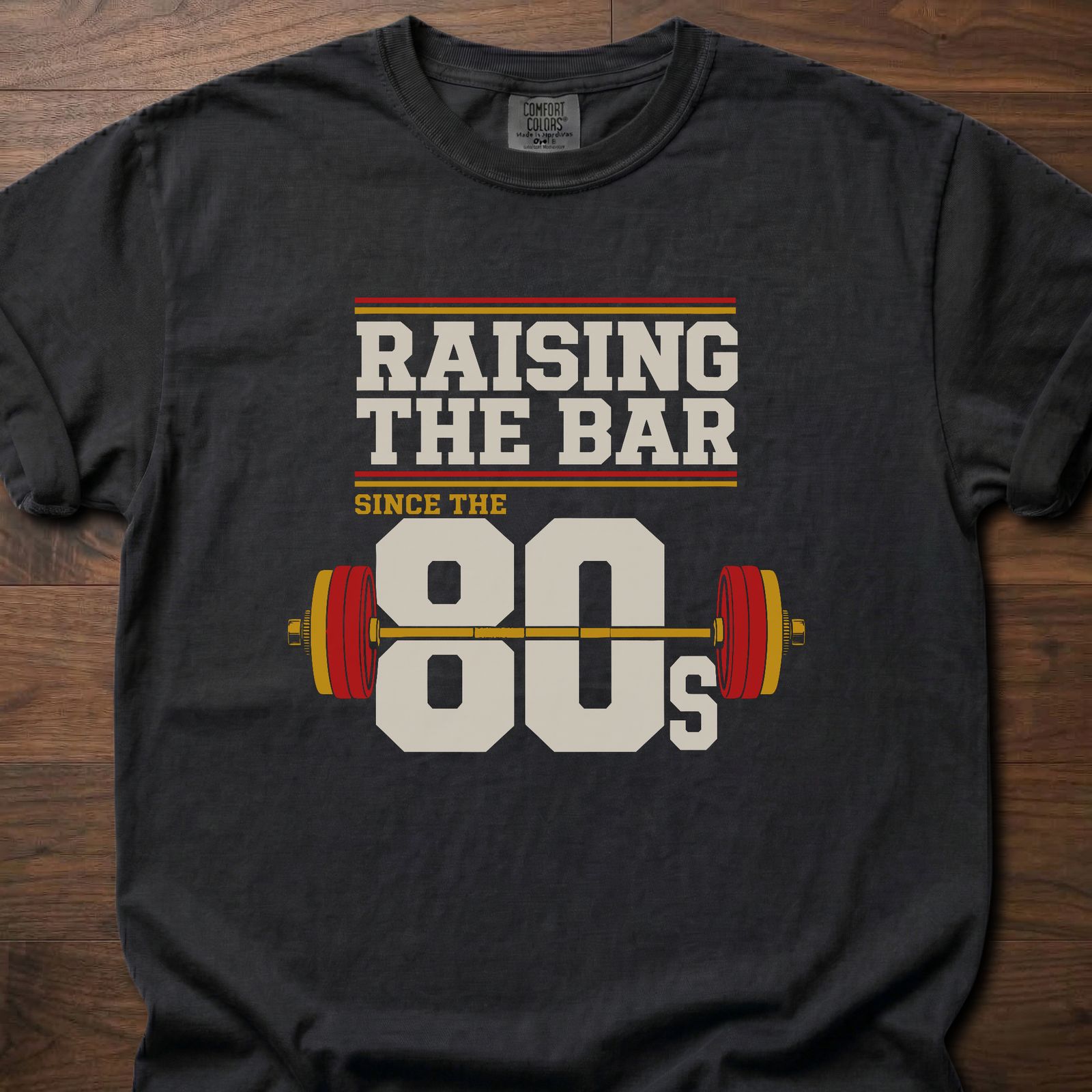Raising The Bar strength training t-shirt with loaded barbell and retro 80s graphic – Black