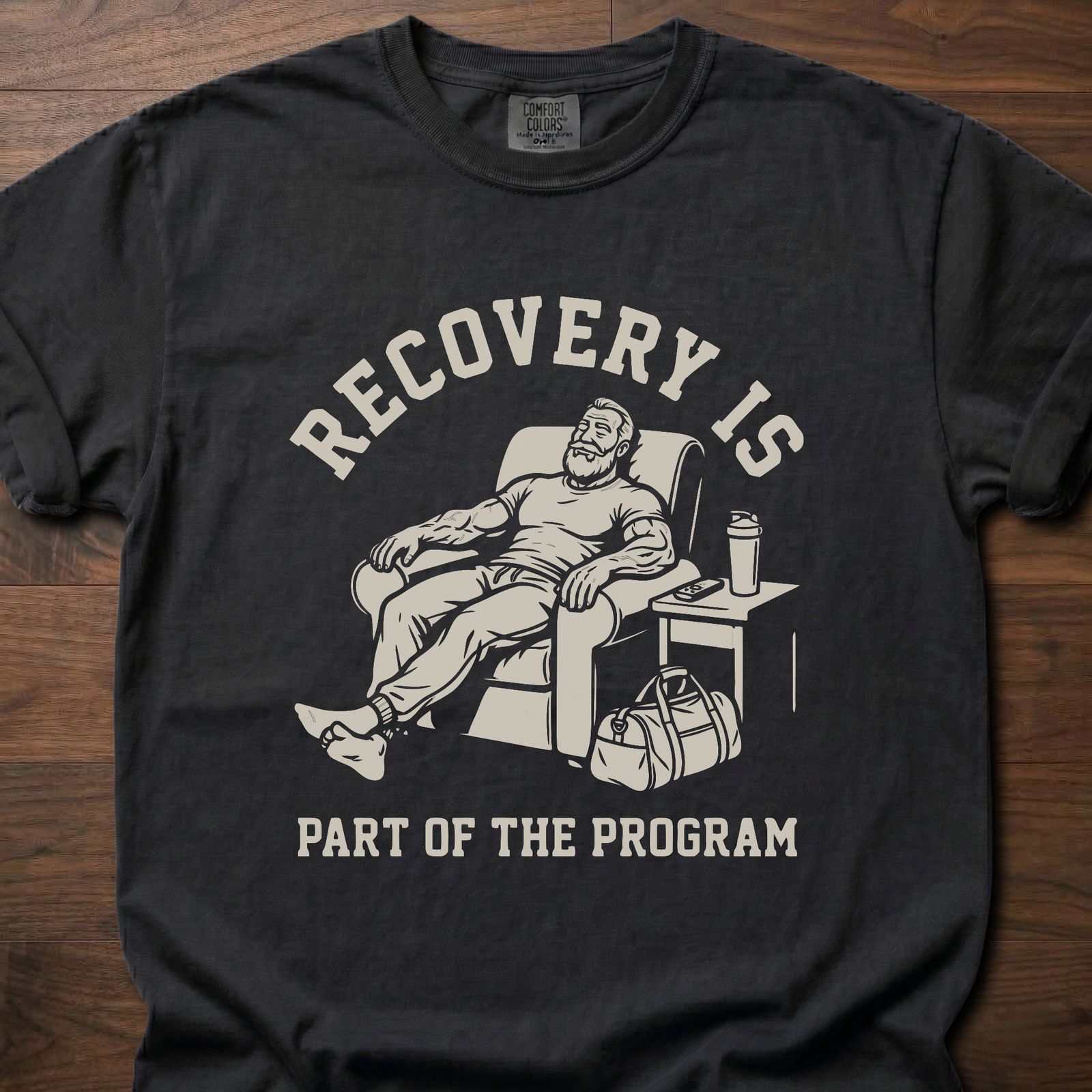 Recovery Is fitness lifestyle apparel featuring relaxed athlete in recliner with gym bag – Black