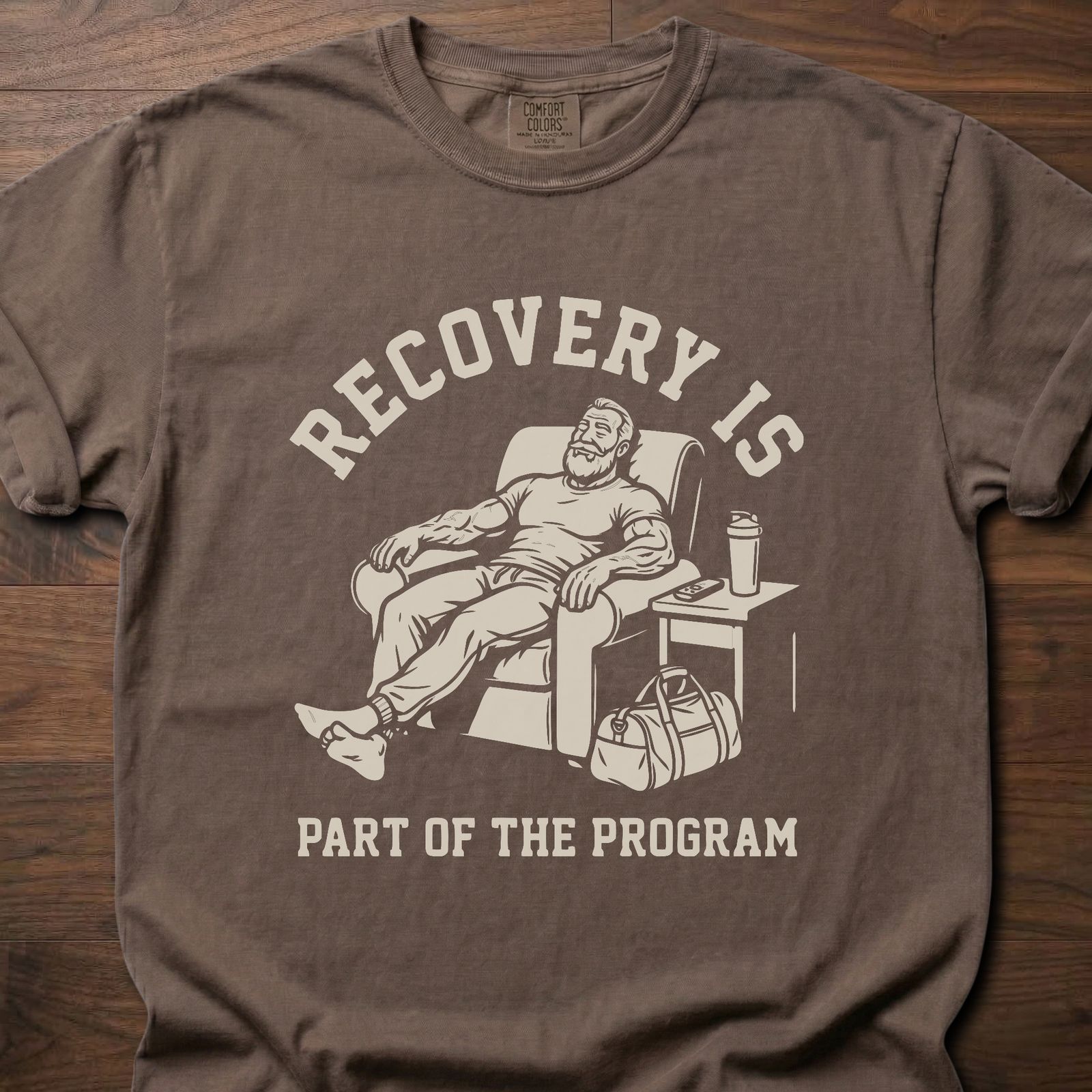 Recovery Is fitness lifestyle apparel featuring relaxed athlete in recliner with gym bag – Espresso