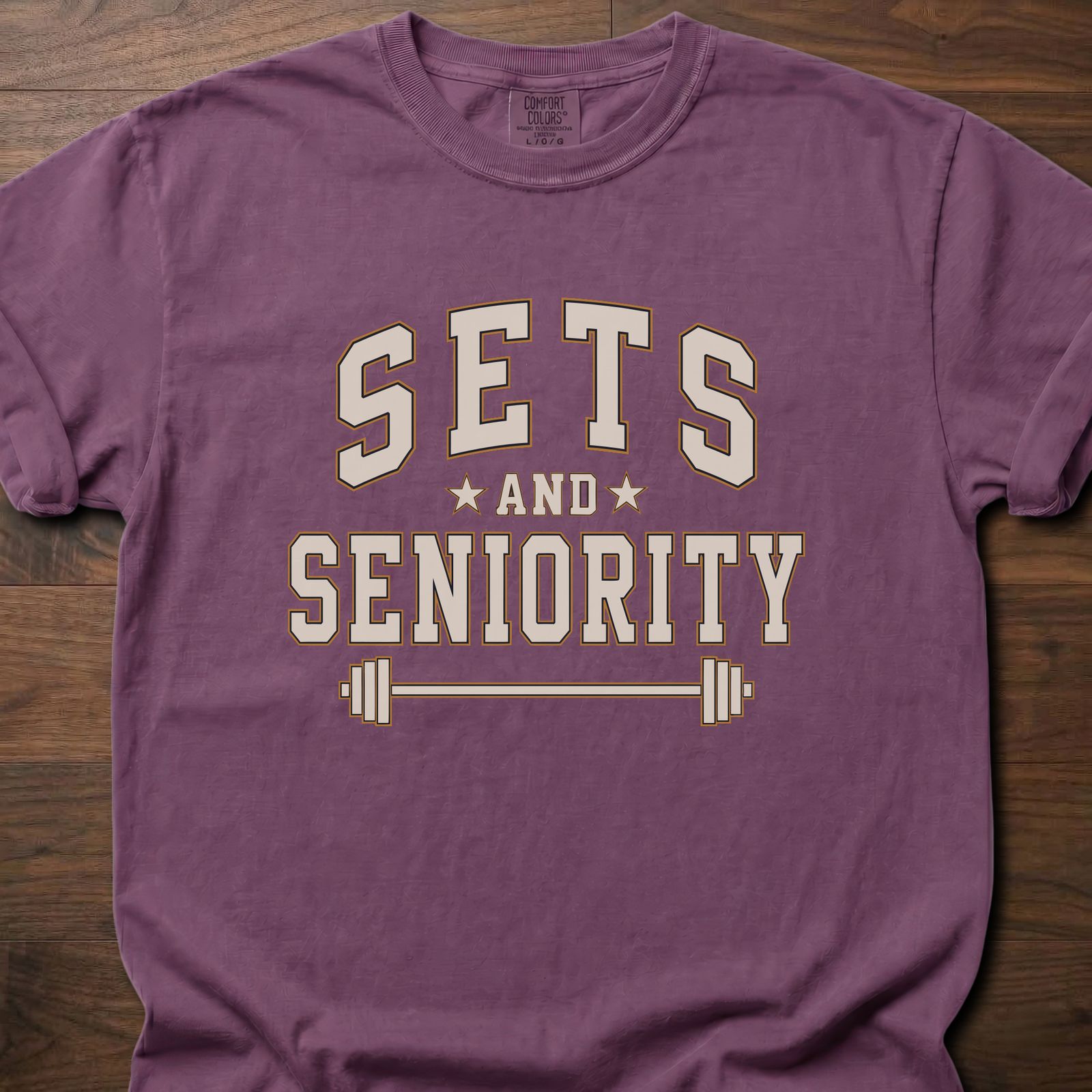 Sets And Seniority strength training t-shirt with collegiate lettering, stars, and barbell graphic – Berry