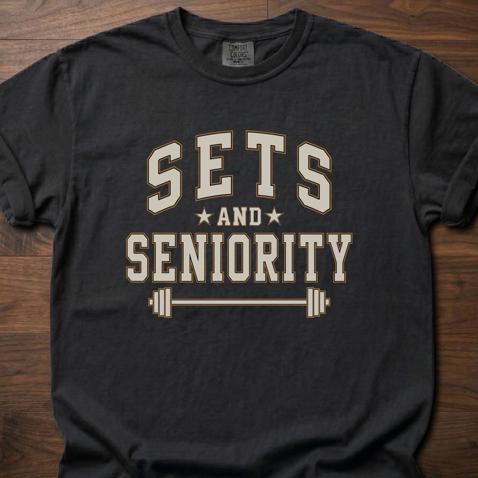 Sets And Seniority strength training t-shirt with collegiate lettering, stars, and barbell graphic – Black