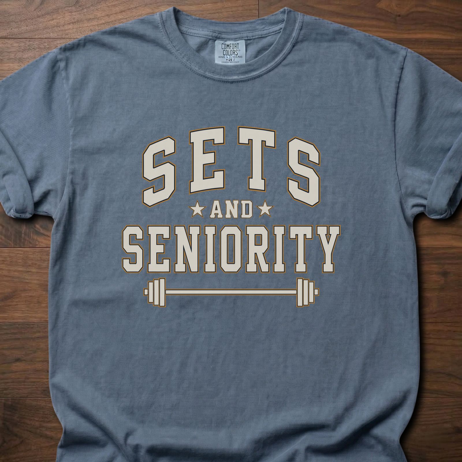 Sets And Seniority strength training t-shirt with collegiate lettering, stars, and barbell graphic – Blue Jean