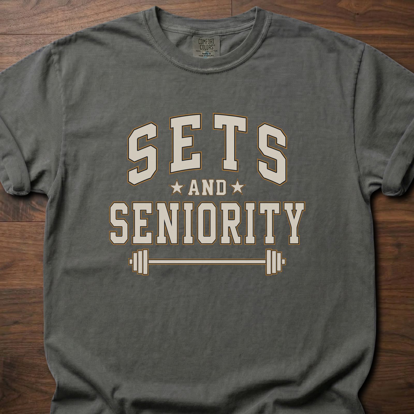 Sets And Seniority strength training t-shirt with collegiate lettering, stars, and barbell graphic – Pepper