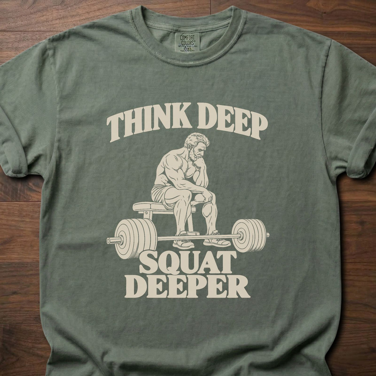 Squat Deeper funny gym shirt with vintage-style bold typographic illustration – Moss