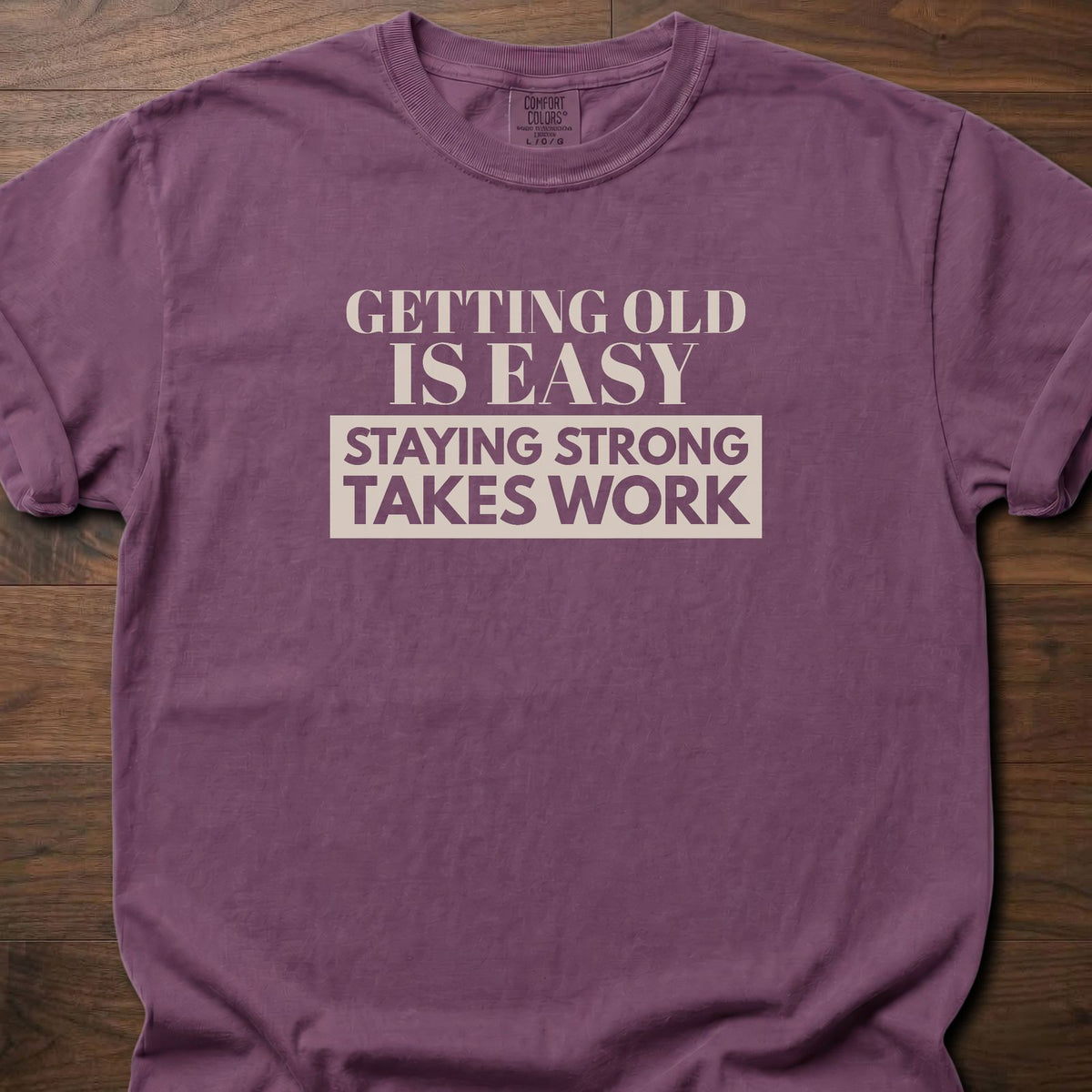 Staying Strong strength training t-shirt with bold vintage-style typographic graphic – Berry