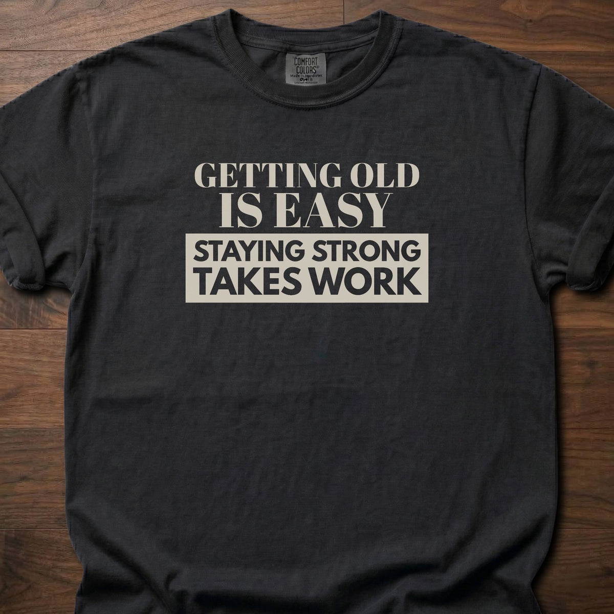 Staying Strong strength training t-shirt with bold vintage-style typographic graphic – Black