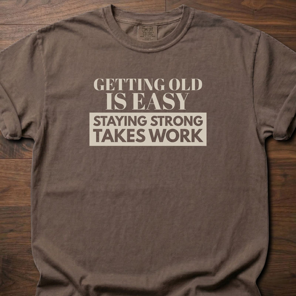Staying Strong strength training t-shirt with bold vintage-style typographic graphic – Espresso