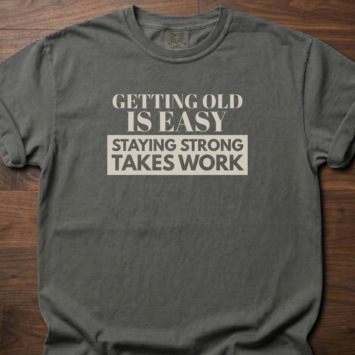 Staying Strong strength training t-shirt with bold vintage-style typographic graphic – Pepper