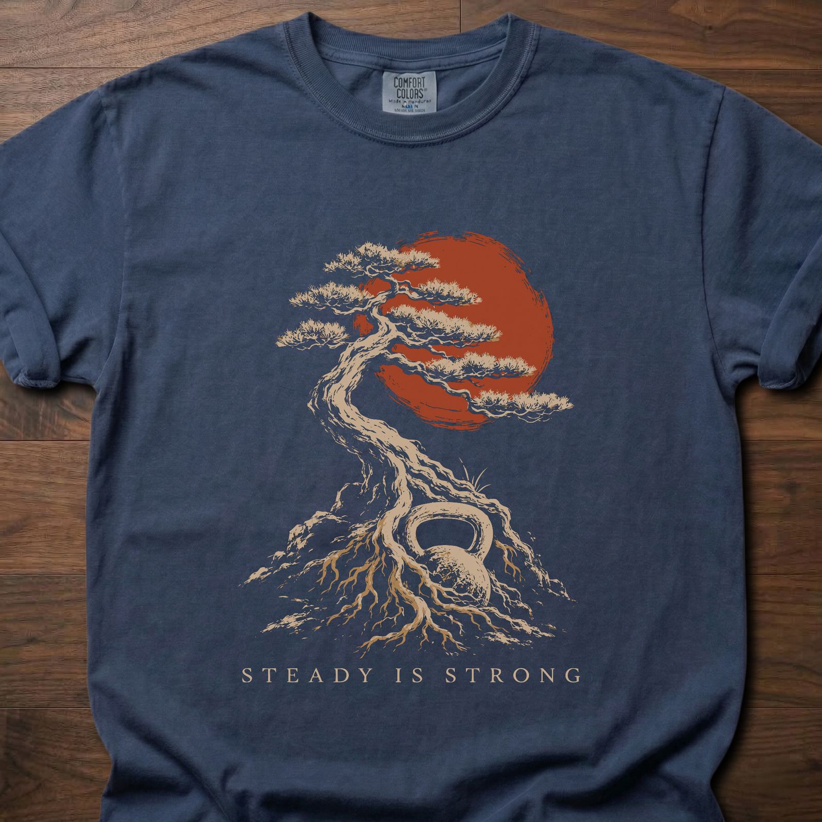 Steady Is Strong strength training lifestyle shirt with bonsai tree, red sun, and kettlebell roots – Navy