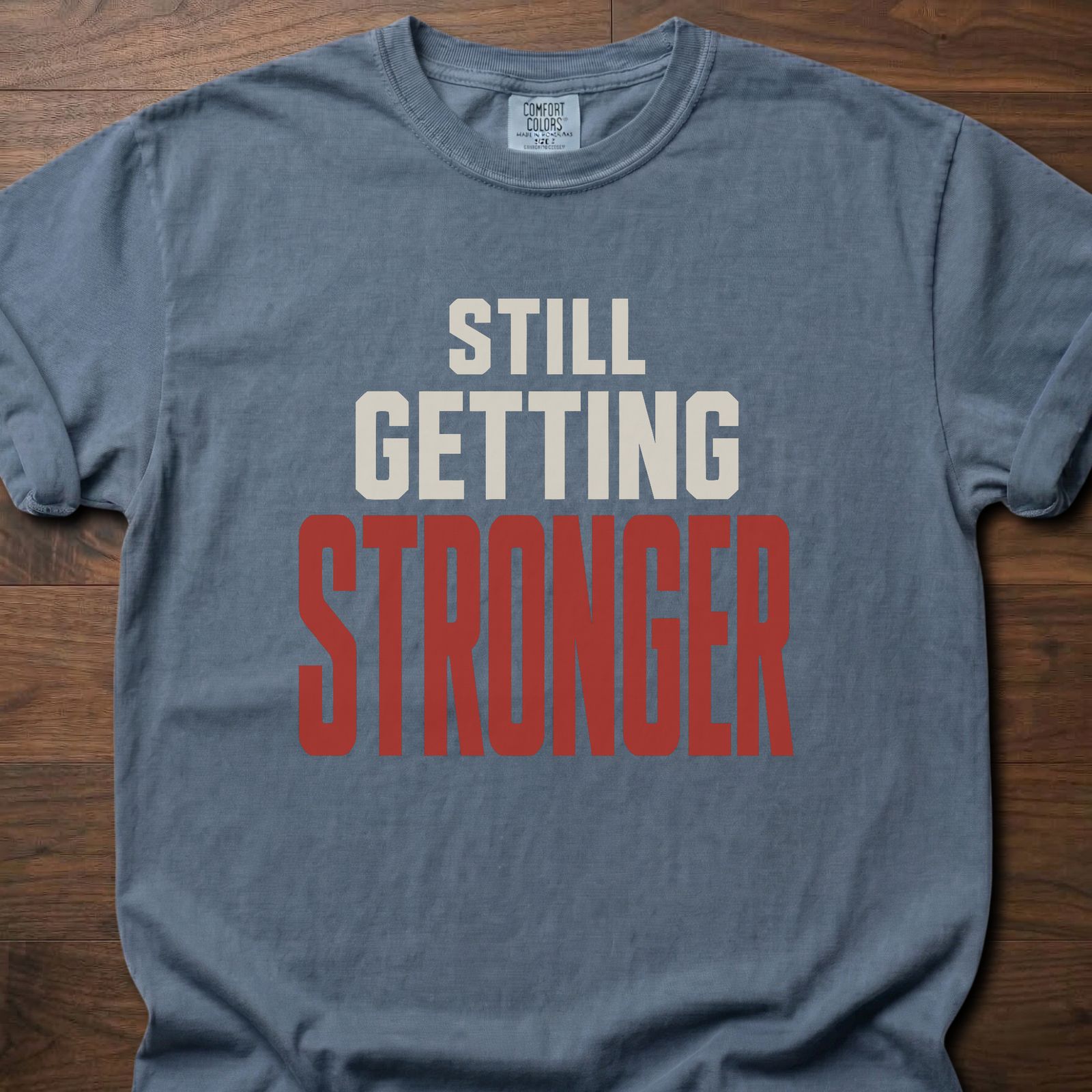 Still Getting Stronger strength training t-shirt with bold stacked block lettering – Blue Jean