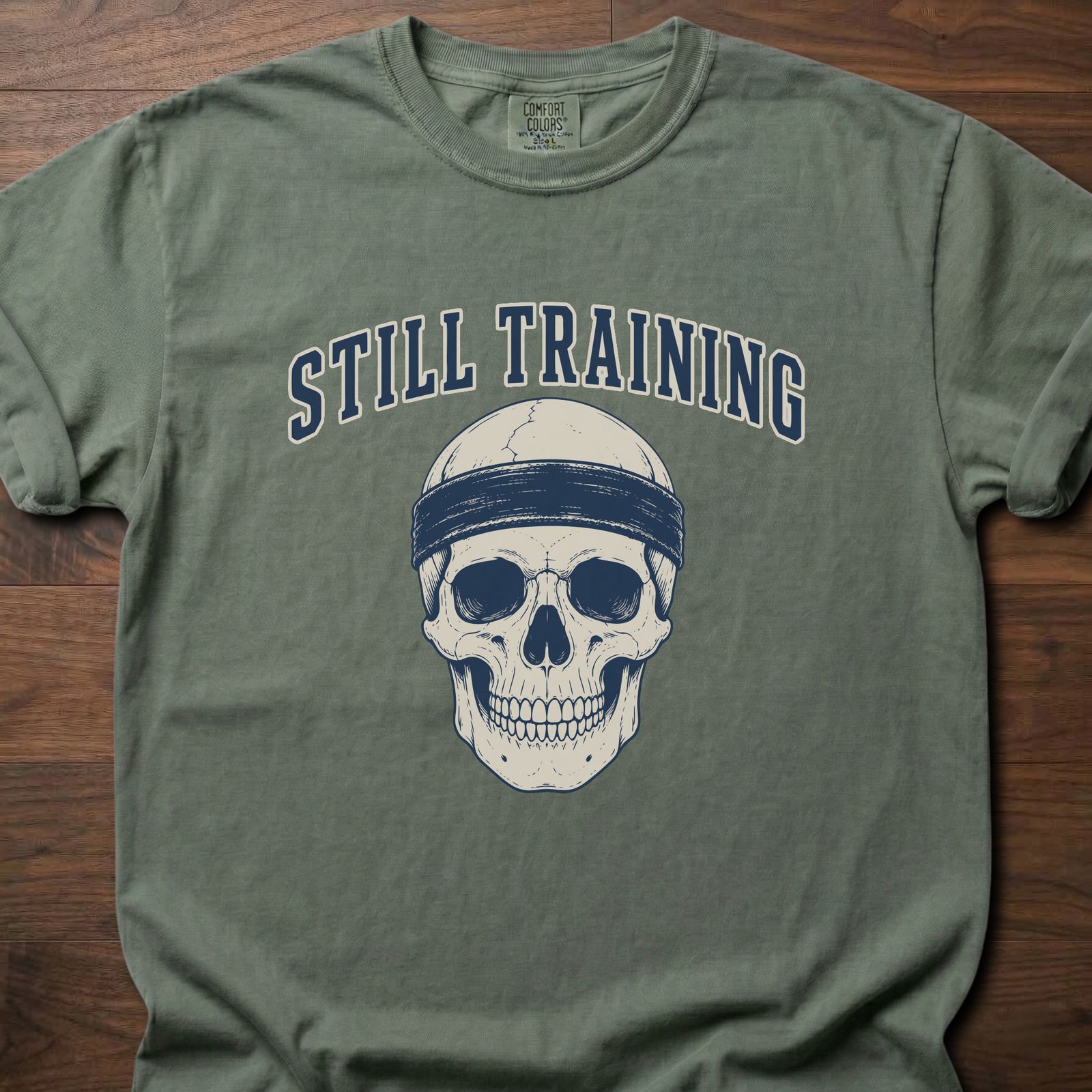 Still Training Skull fitness lifestyle t shirt featuring skull with headband graphic – Moss