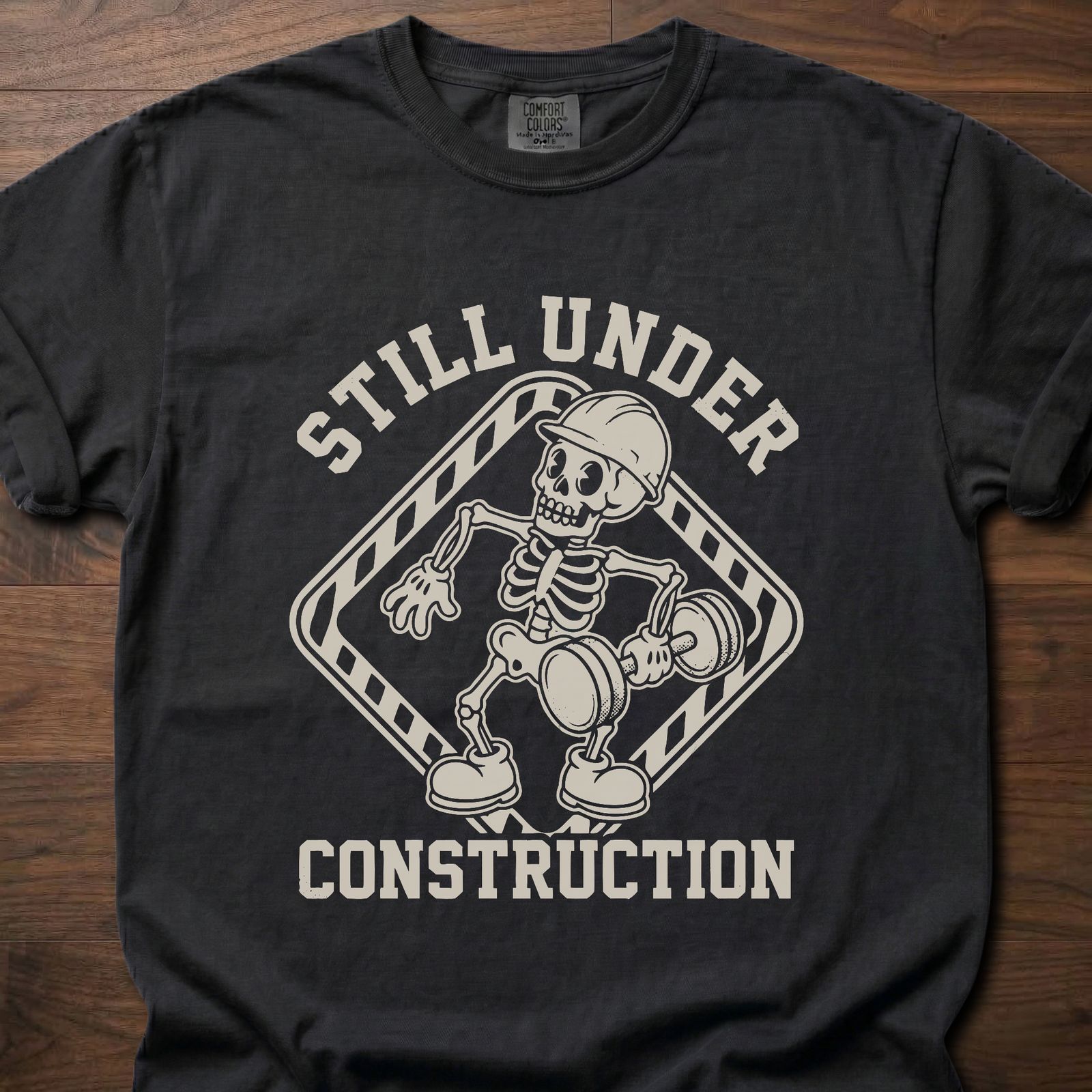 Still Under Construction strength training t shirt featuring skeleton with hard hat and caution tape design – Black