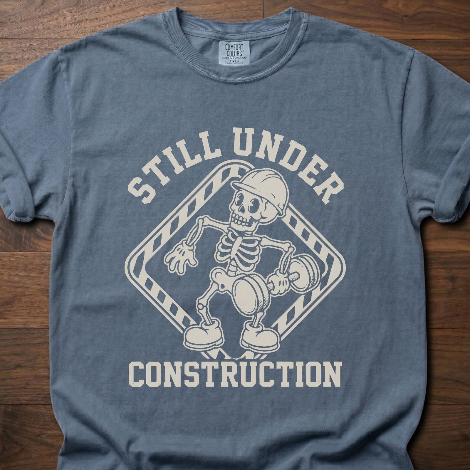 Still Under Construction strength training t shirt featuring skeleton with hard hat and caution tape design – Blue Jean