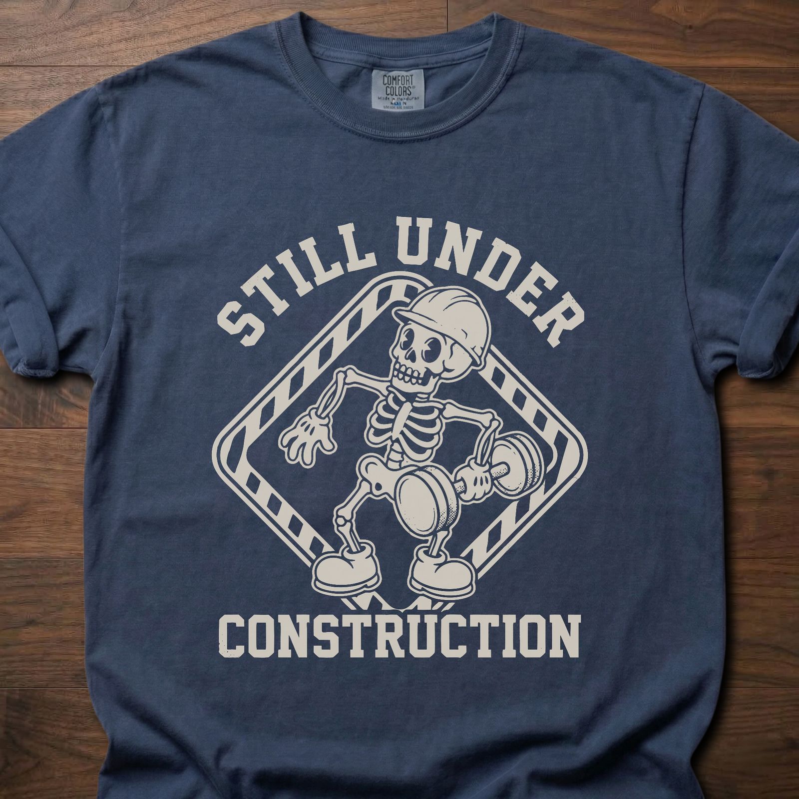 Still Under Construction strength training t shirt featuring skeleton with hard hat and caution tape design – Navy