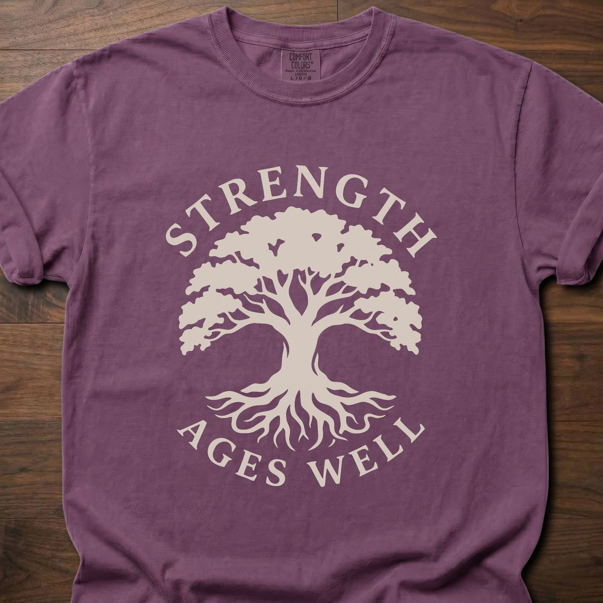 Strength Ages Well strength training t-shirt with tree of life design symbolizing deep roots and growth – Berry