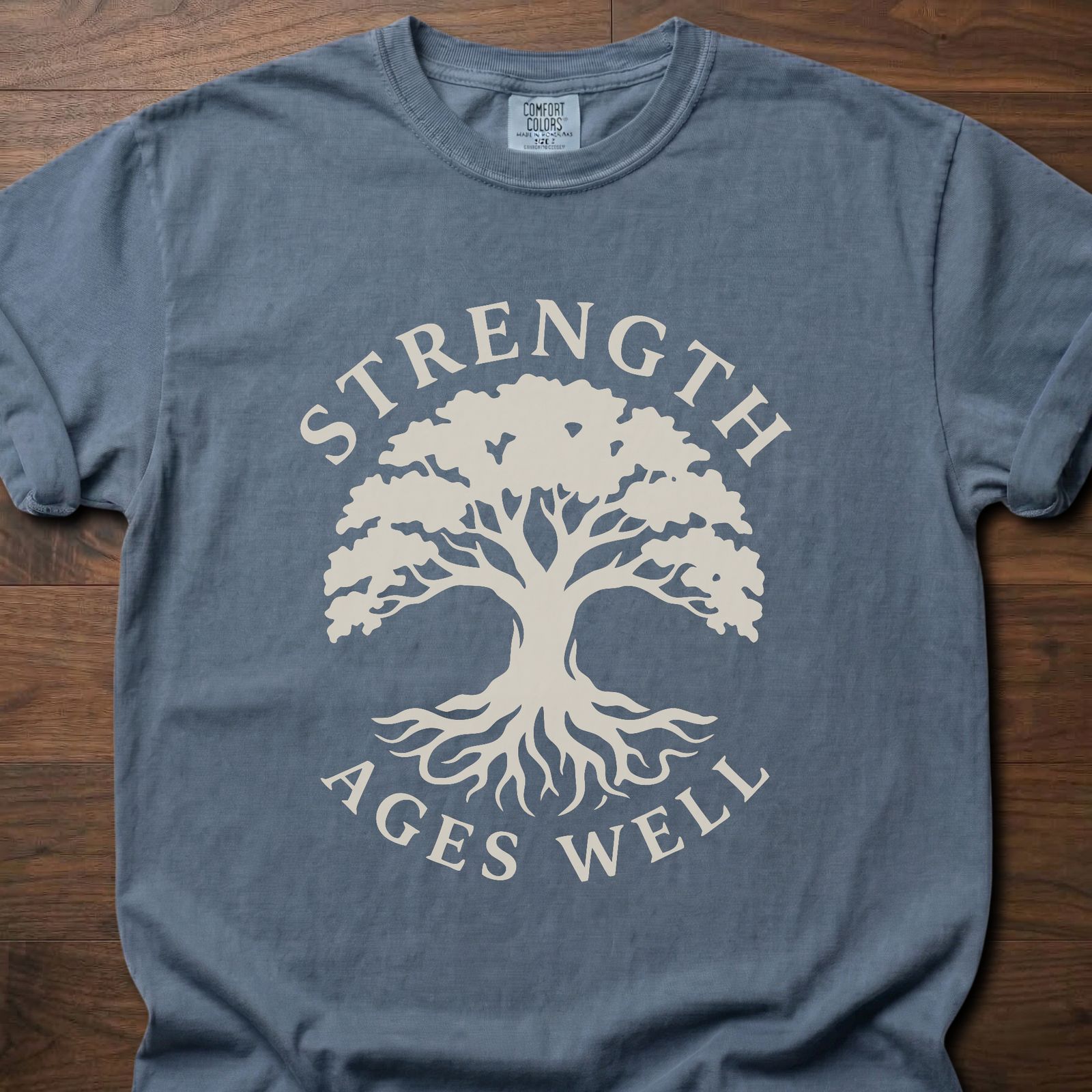 Strength Ages Well strength training t-shirt with tree of life design symbolizing deep roots and growth – Blue Jean