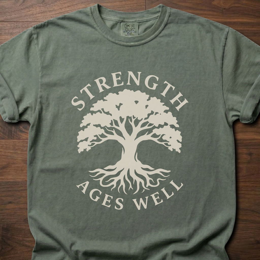 Strength Ages Well strength training t-shirt with tree of life design symbolizing deep roots and growth – Moss