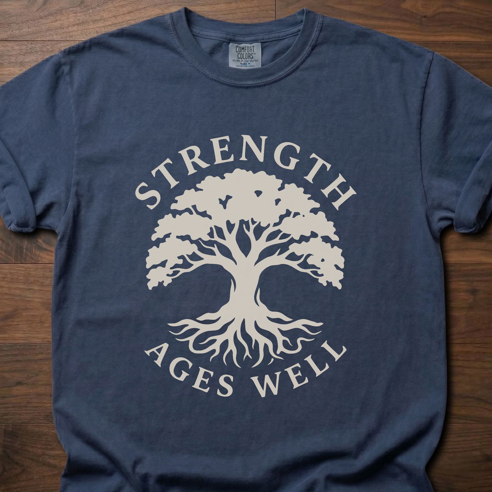 Strength Ages Well strength training t-shirt with tree of life design symbolizing deep roots and growth – Navy