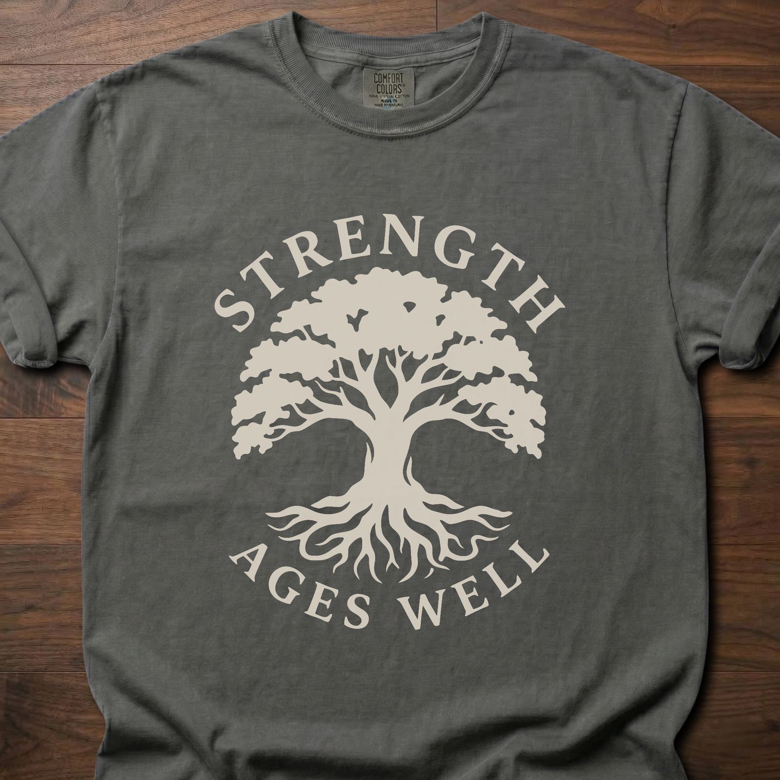 Strength Ages Well strength training t-shirt with tree of life design symbolizing deep roots and growth – Pepper