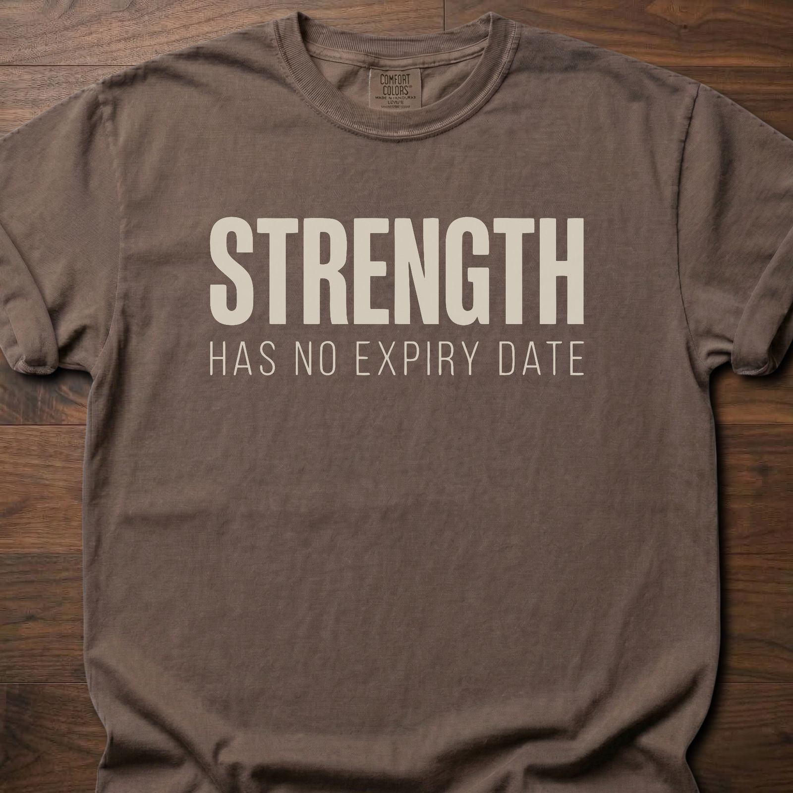Strength Has No Expiry Date strength training t-shirt with bold text design – Espresso