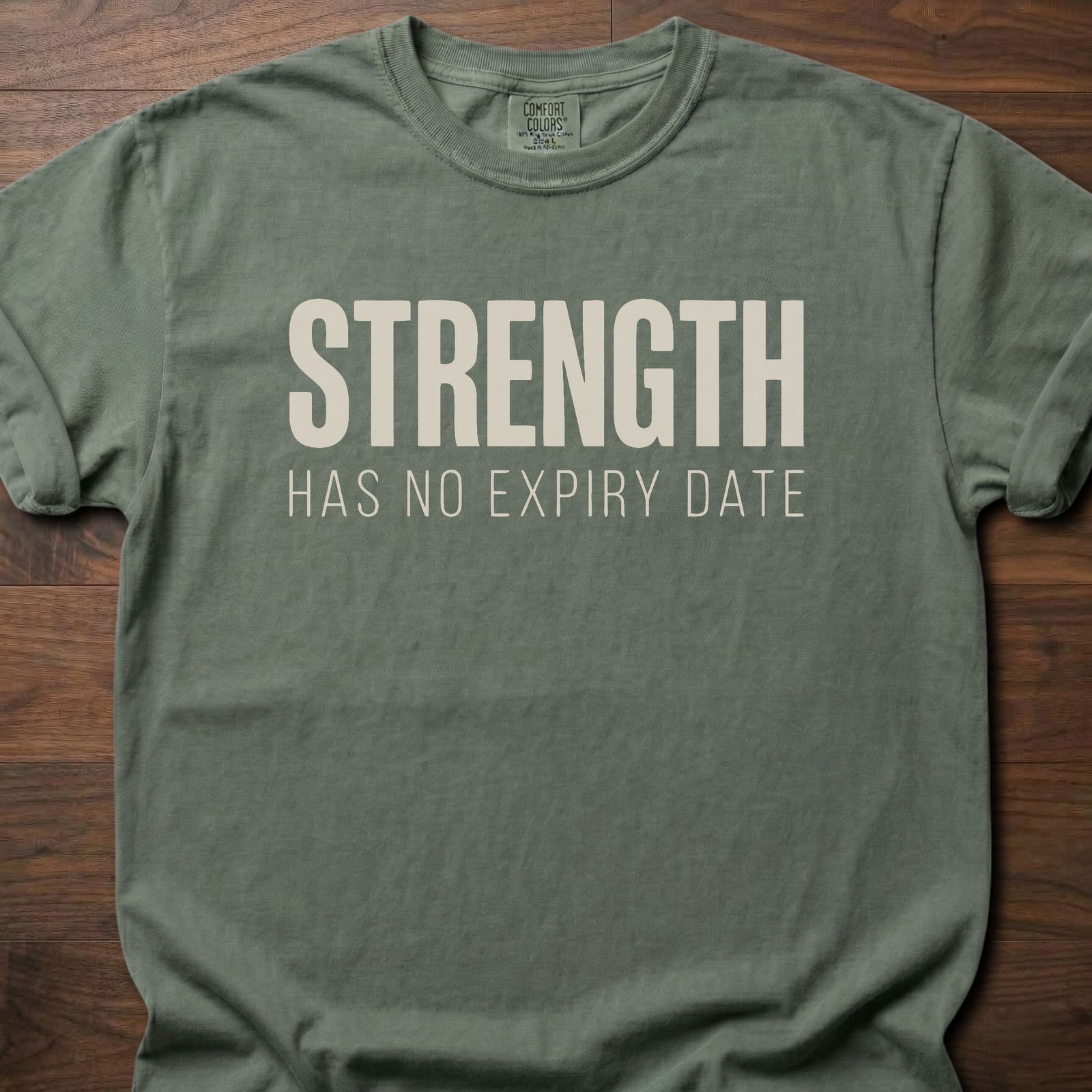 Strength Has No Expiry Date strength training t-shirt with bold text design – Moss