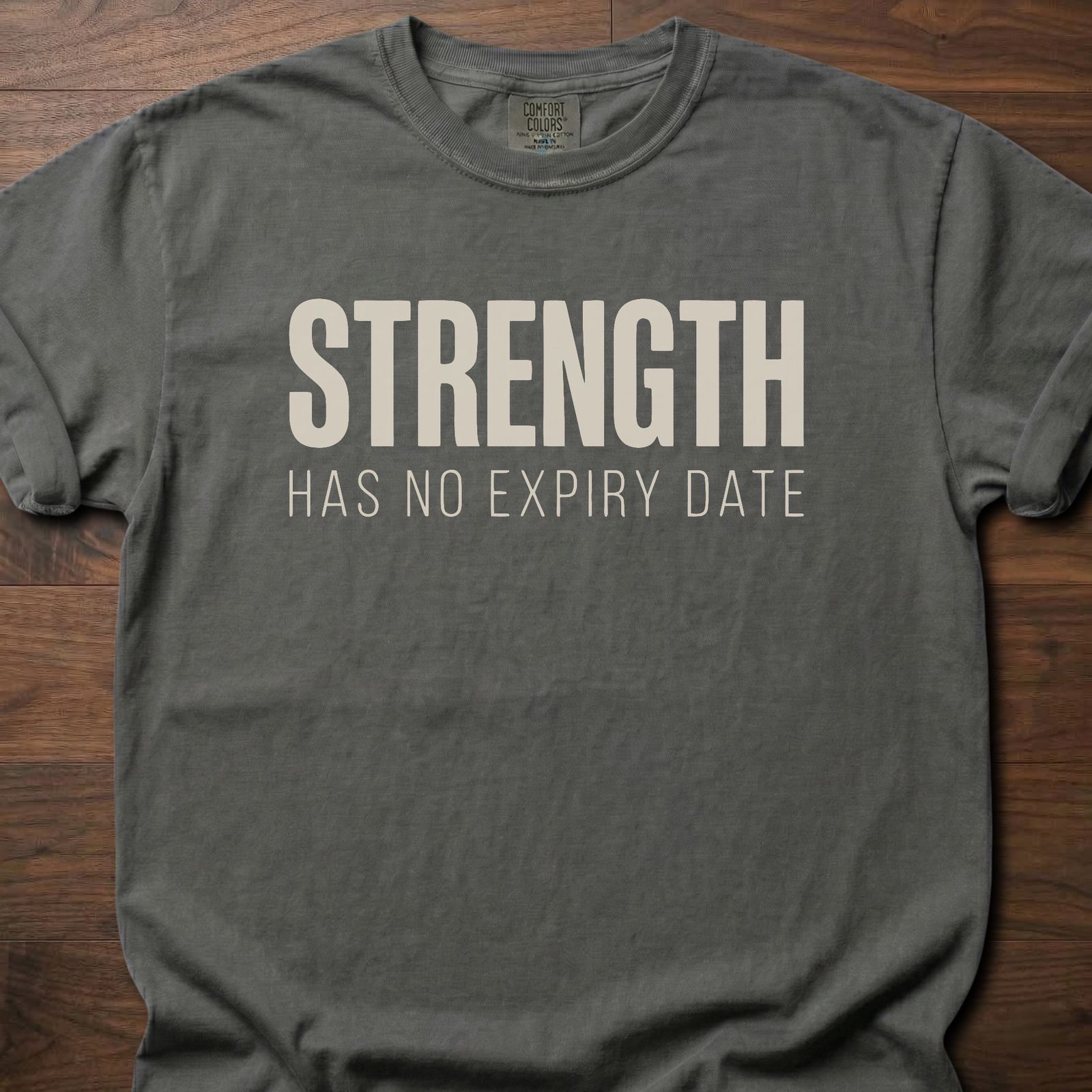 Strength Has No Expiry Date strength training t-shirt with bold text design – Pepper