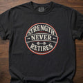 Strength Never Retires fitness lifestyle apparel shirt with circular badge and barbell design – Black