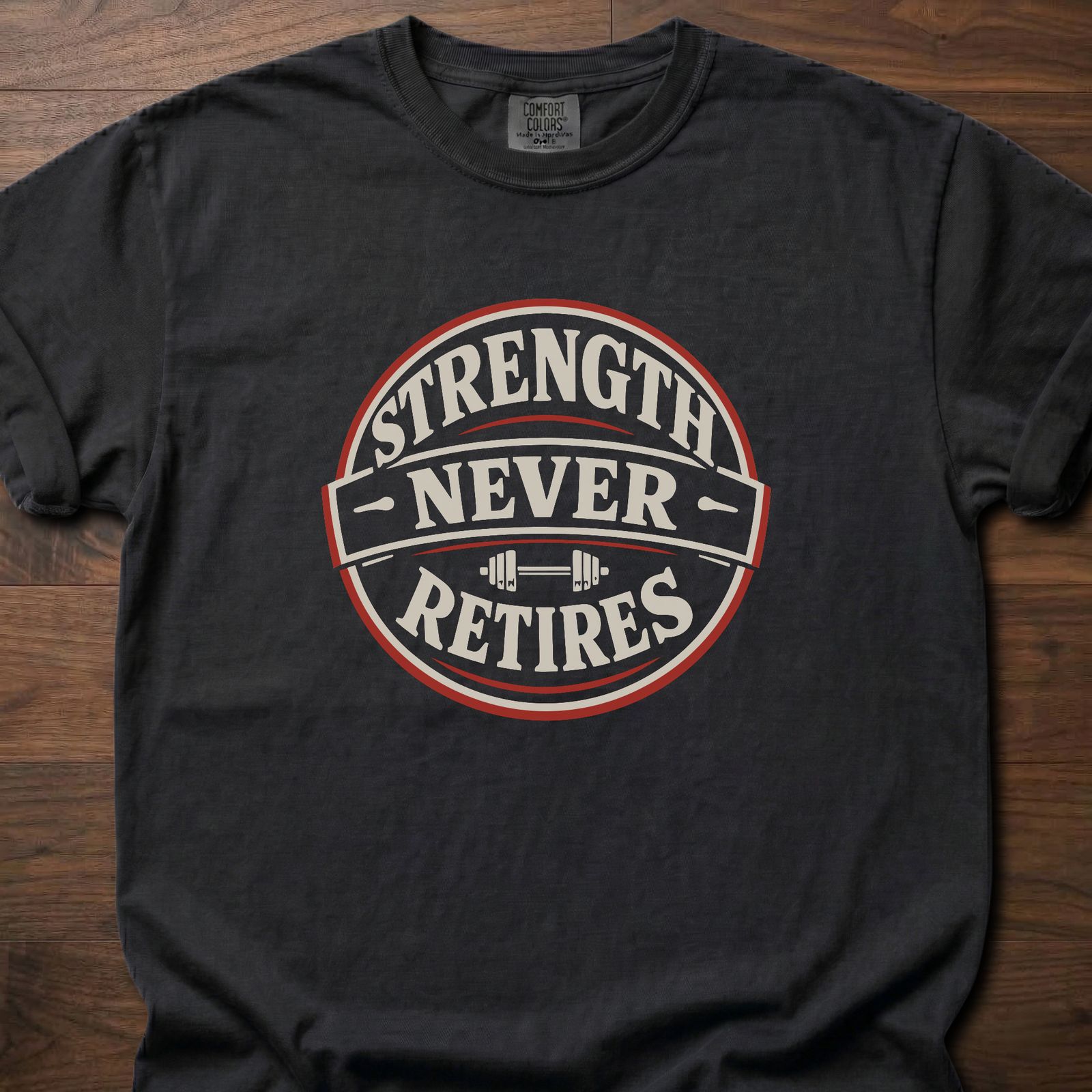 Strength Never Retires fitness lifestyle apparel shirt with circular badge and barbell design – Black