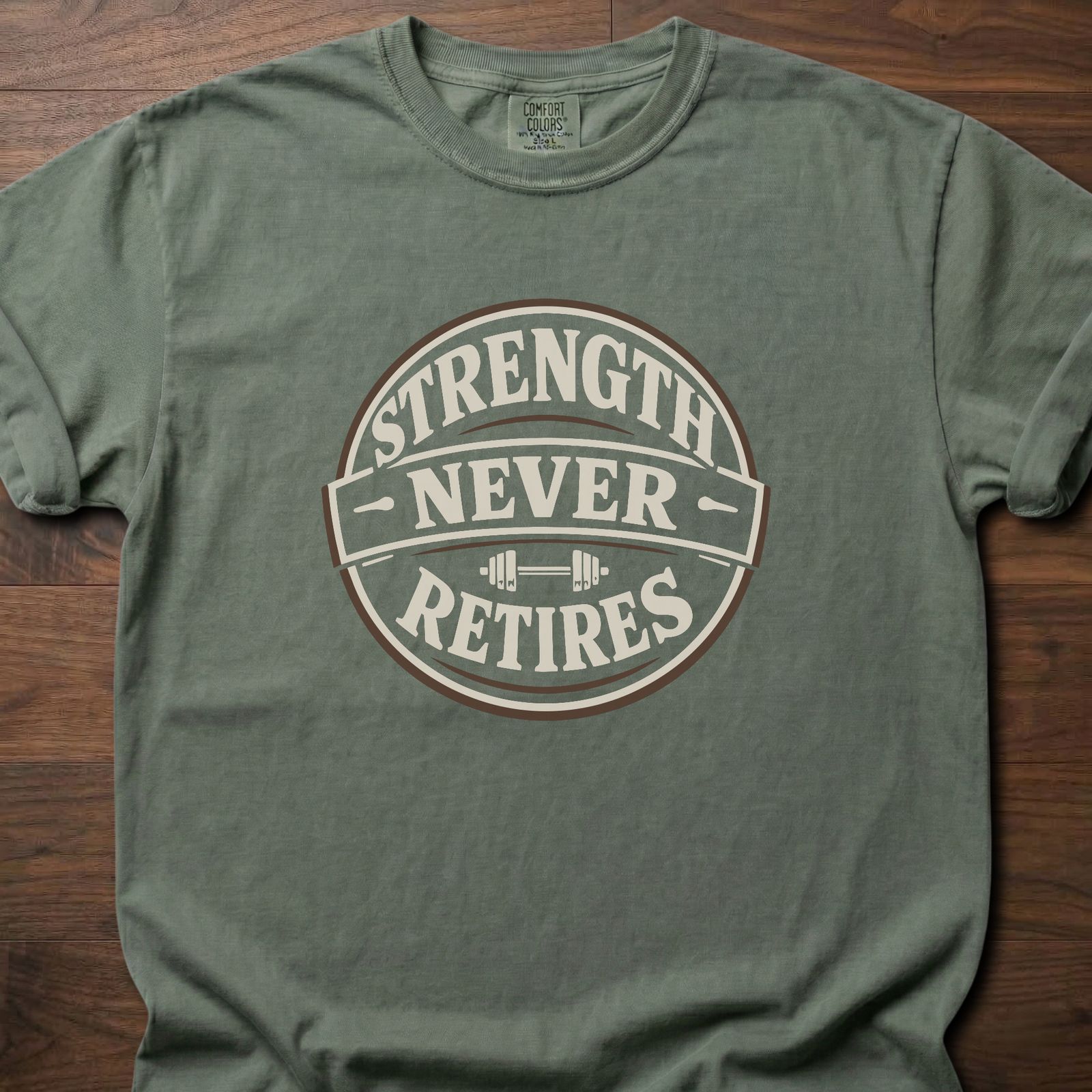 Strength Never Retires fitness lifestyle apparel shirt with circular badge and barbell design – Moss