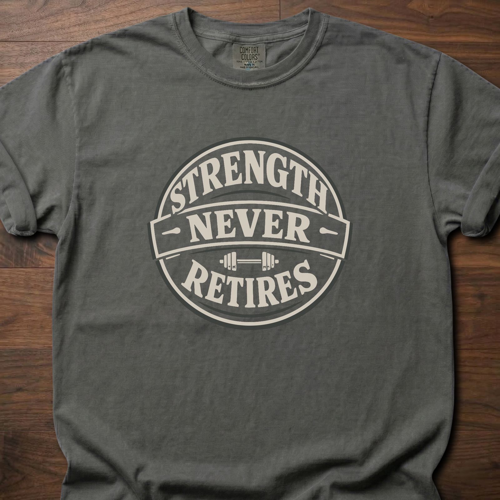 Strength Never Retires fitness lifestyle apparel shirt with circular badge and barbell design – Pepper