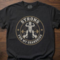 Strong For My Grandkids gym lifestyle shirt featuring grandfather carrying child with barbell and stars – Black