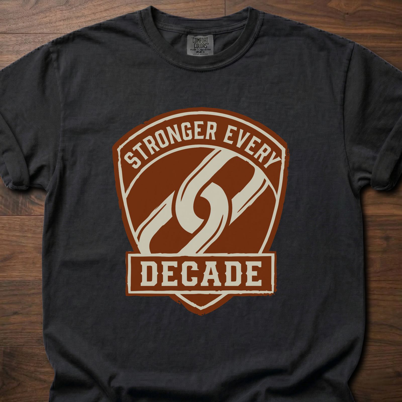 Stronger Every Decade strength training lifestyle clothing with shield emblem and diagonal stripe design – Black