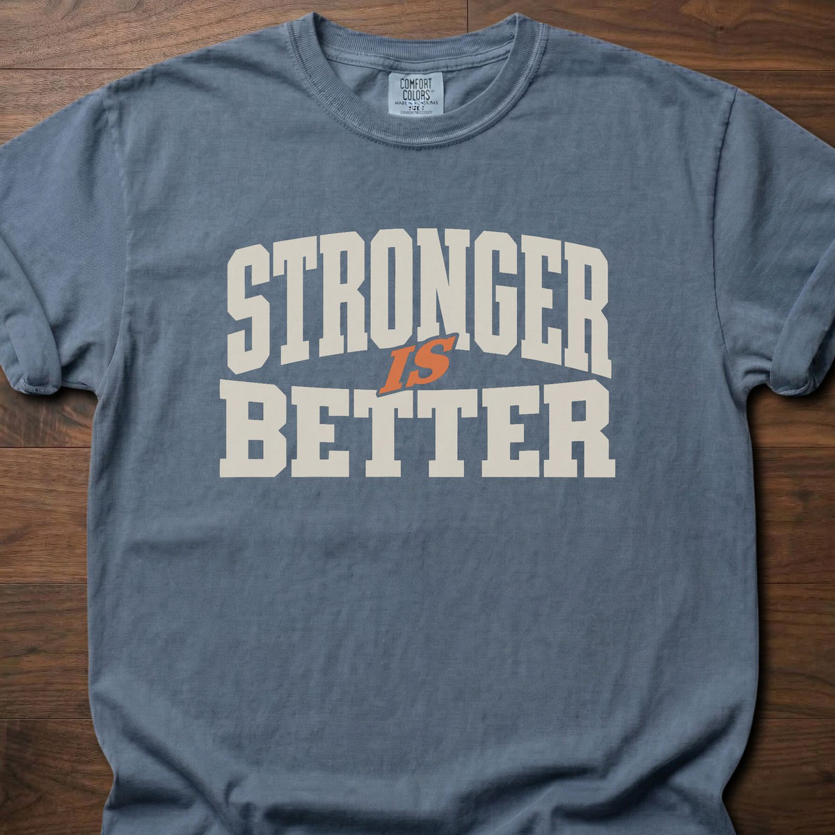 Stronger Is Better strength training t-shirt with bold collegiate block letter graphic – Blue Jean