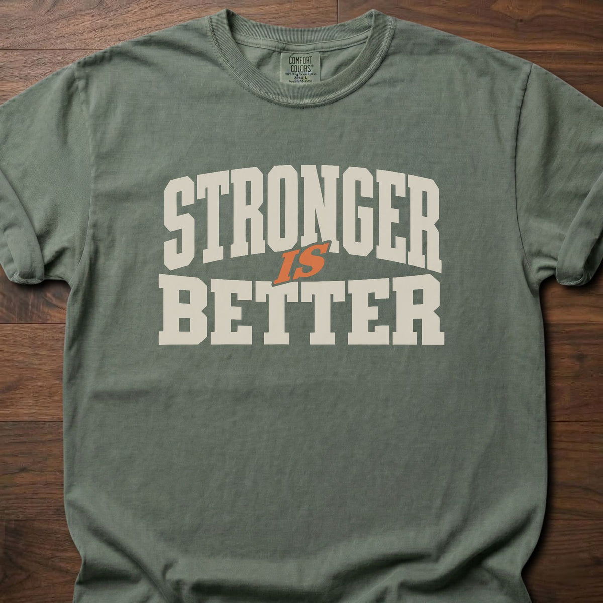 Stronger Is Better strength training t-shirt with bold collegiate block letter graphic – Moss
