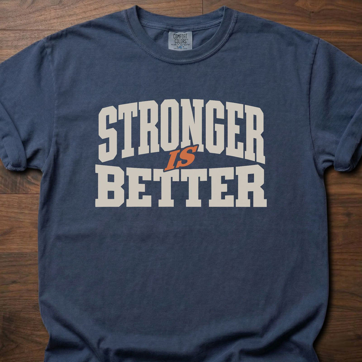 Stronger Is Better strength training t-shirt with bold collegiate block letter graphic – Navy