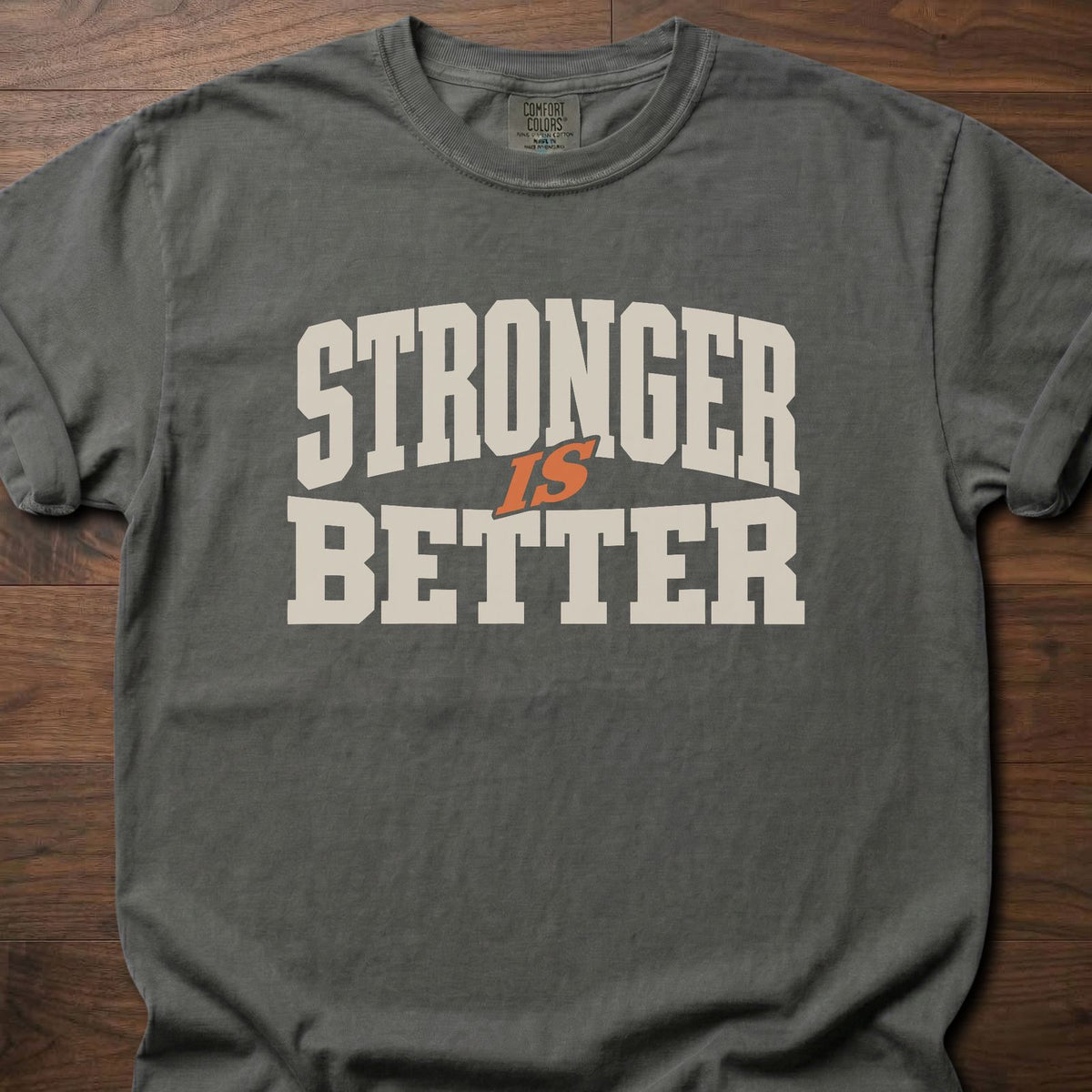 Stronger Is Better strength training t-shirt with bold collegiate block letter graphic – Pepper
