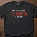 The Heavier I Lift fitness lifestyle t-shirt with bold stacked block-letter text design – Black