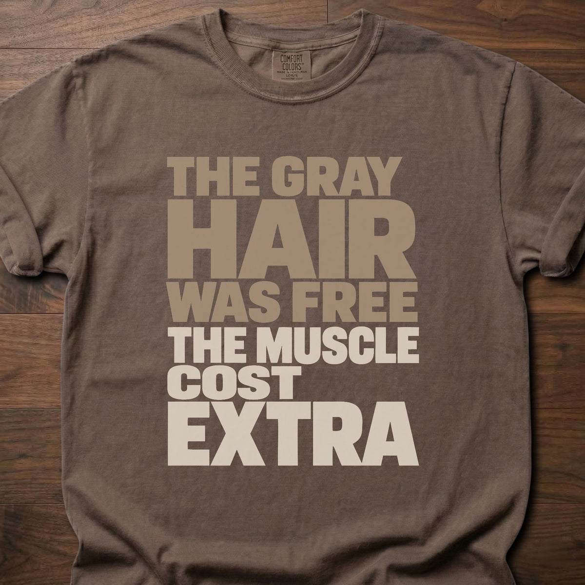 The Muscle Cost Extra funny gym shirt with bold stacked block letter graphic – Espresso